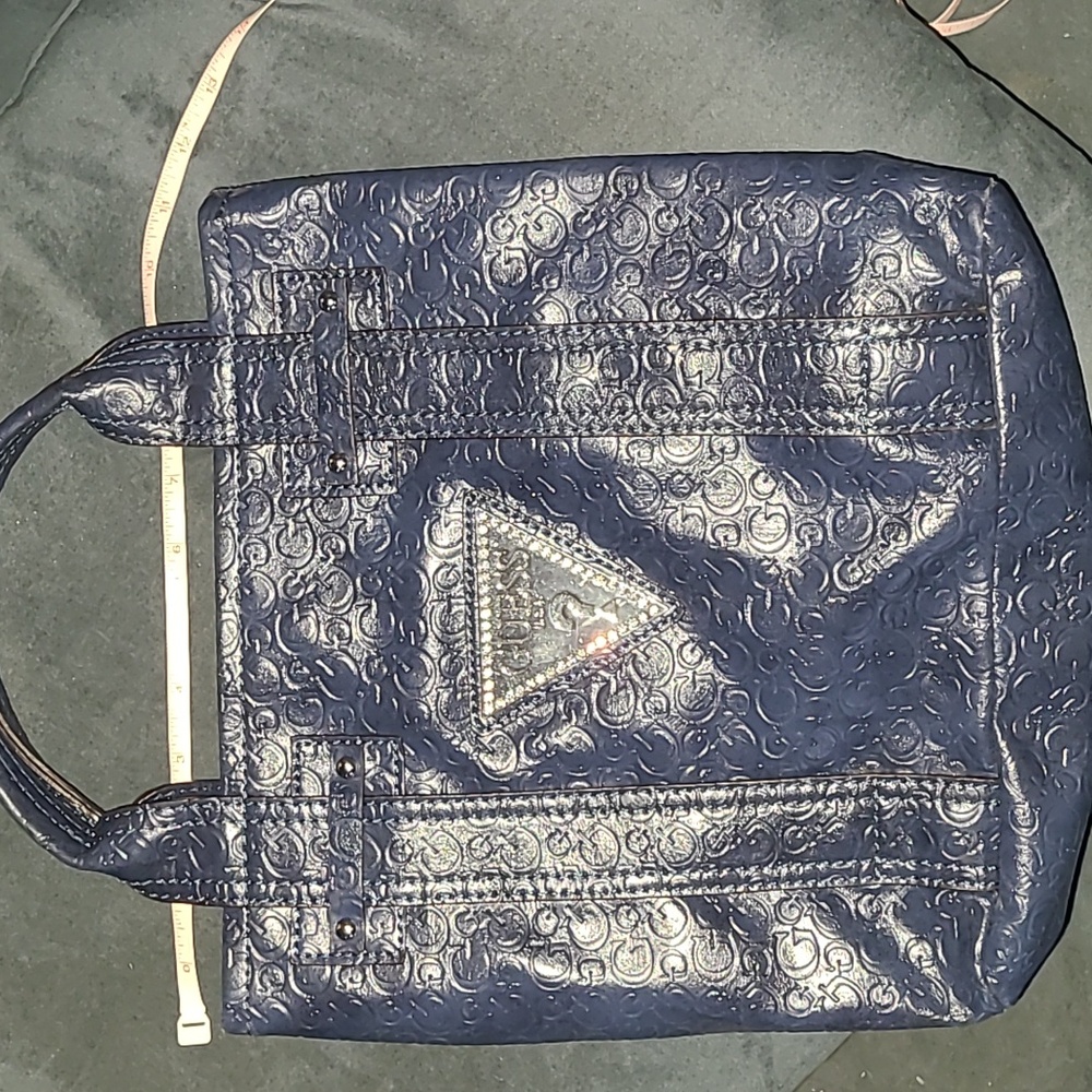 Guess handbag , brand emblem , shiny navy blue, dbl. handle,”G” pattern
